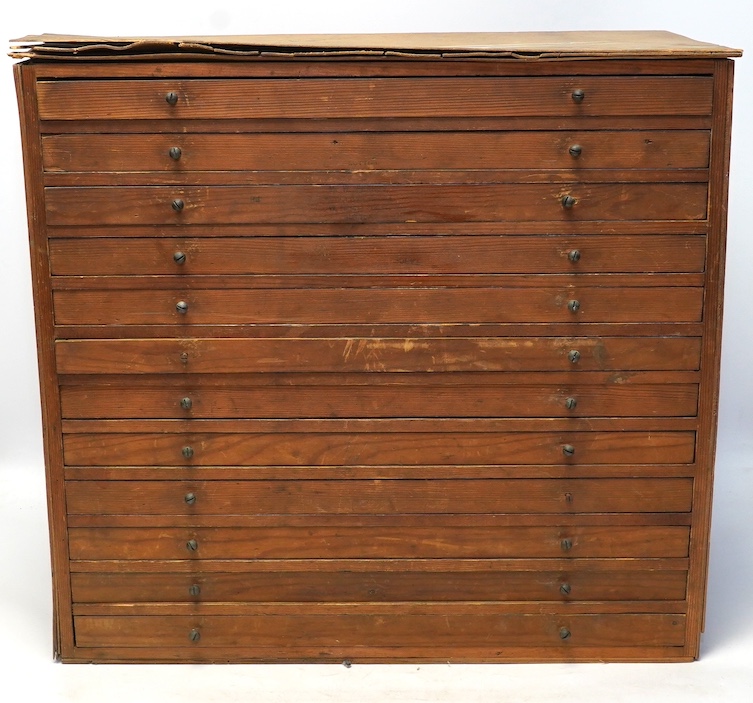 A wooden twelve drawer cabinet containing a collection of watch parts. Condition - cabinet fair to good, watch parts as found